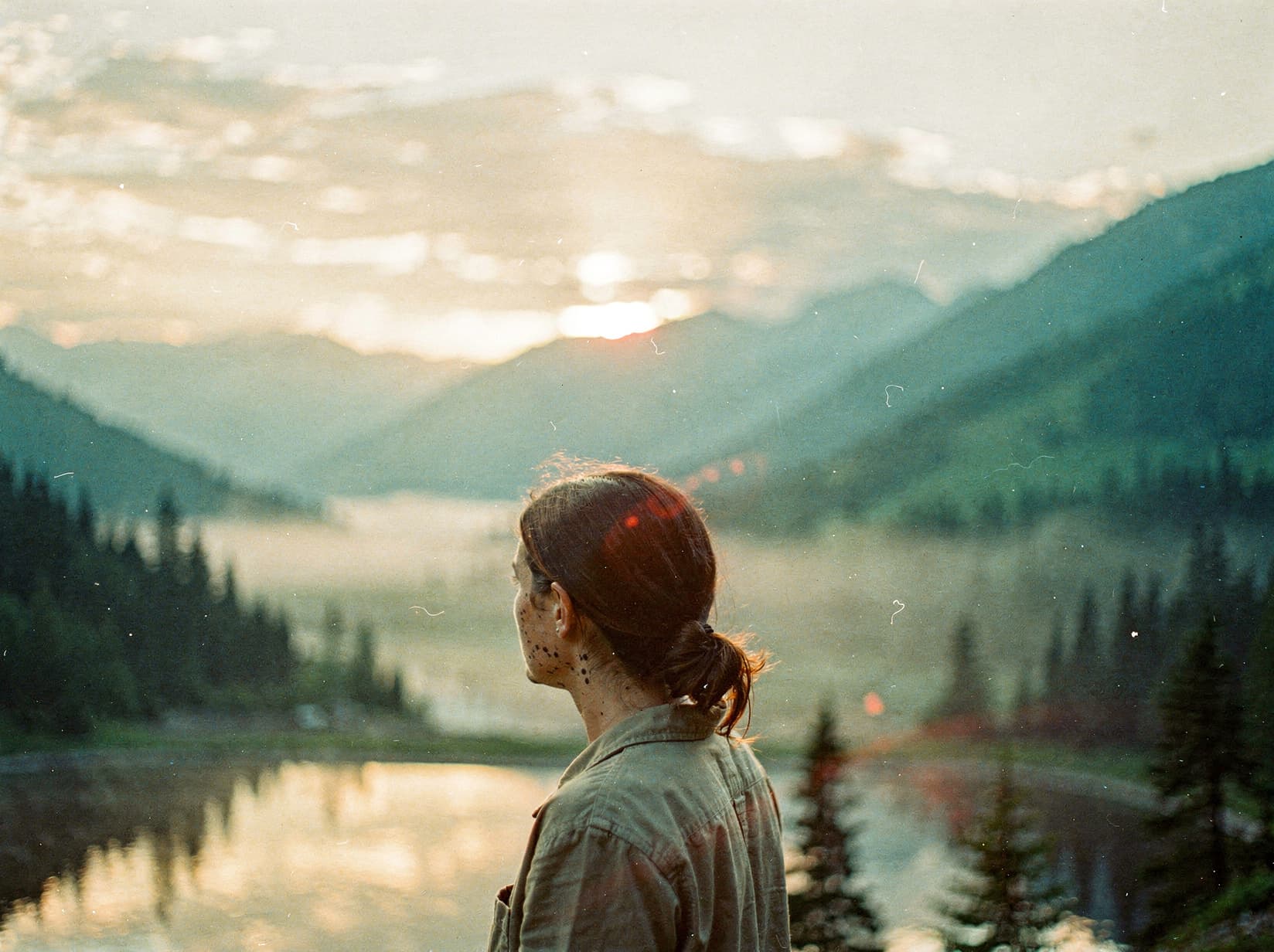 Serene sunrise over misty mountains, a hopeful new beginning